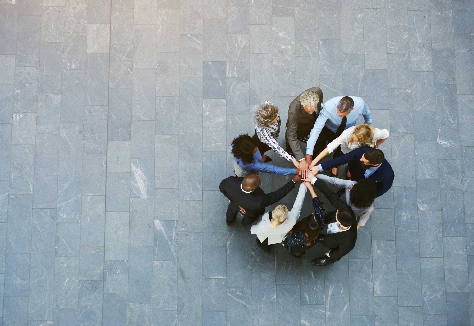 group of professionals in a huddle